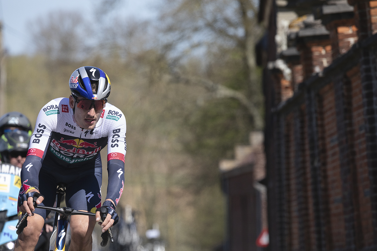 Ronde van Vlaanderen 2025 - Tim van Dijke rides next to a grand wall