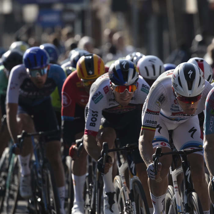 Scheldeprijs 2025 - Tim Merlier in the European Champion’s jersey tucks in behind a lead out train in Schoten