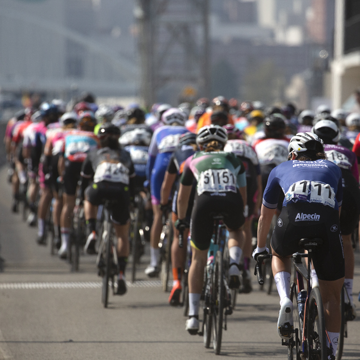 Scheldeprijs 2023 Vrouwen - A view of the back of the women’s peloton as it rides down the side of the Albertkanaal