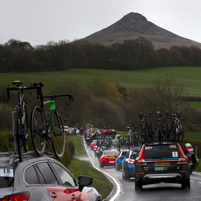 Tour de Yorkshire 2016 - The race convoy follows the peloton with Roseberry Topping clearly visible in the background