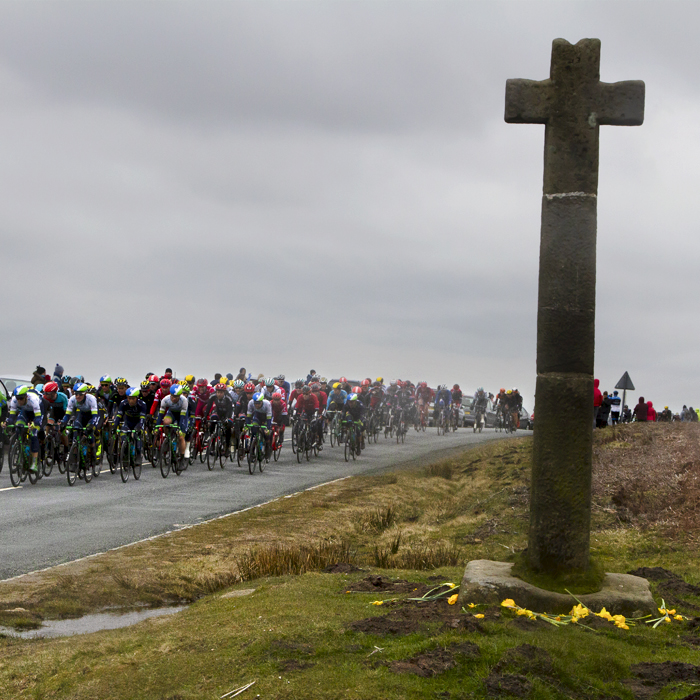 Tour de Yorkshire 2016 -The peloton passes by Ralph’s Cross on the North York Moors