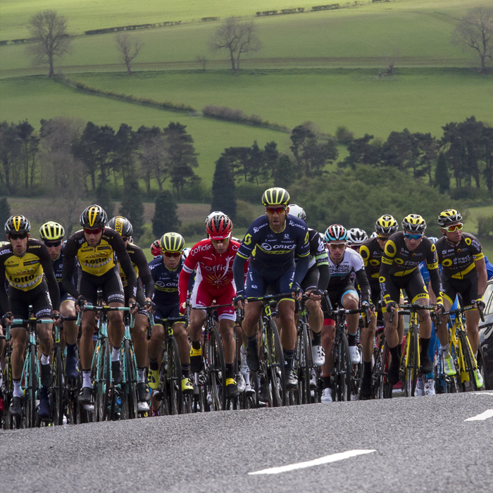 Tour de Yorkshire 2017 - the peloton climbs the hill at Goathland with the Yorkshire countryside as a backdrop