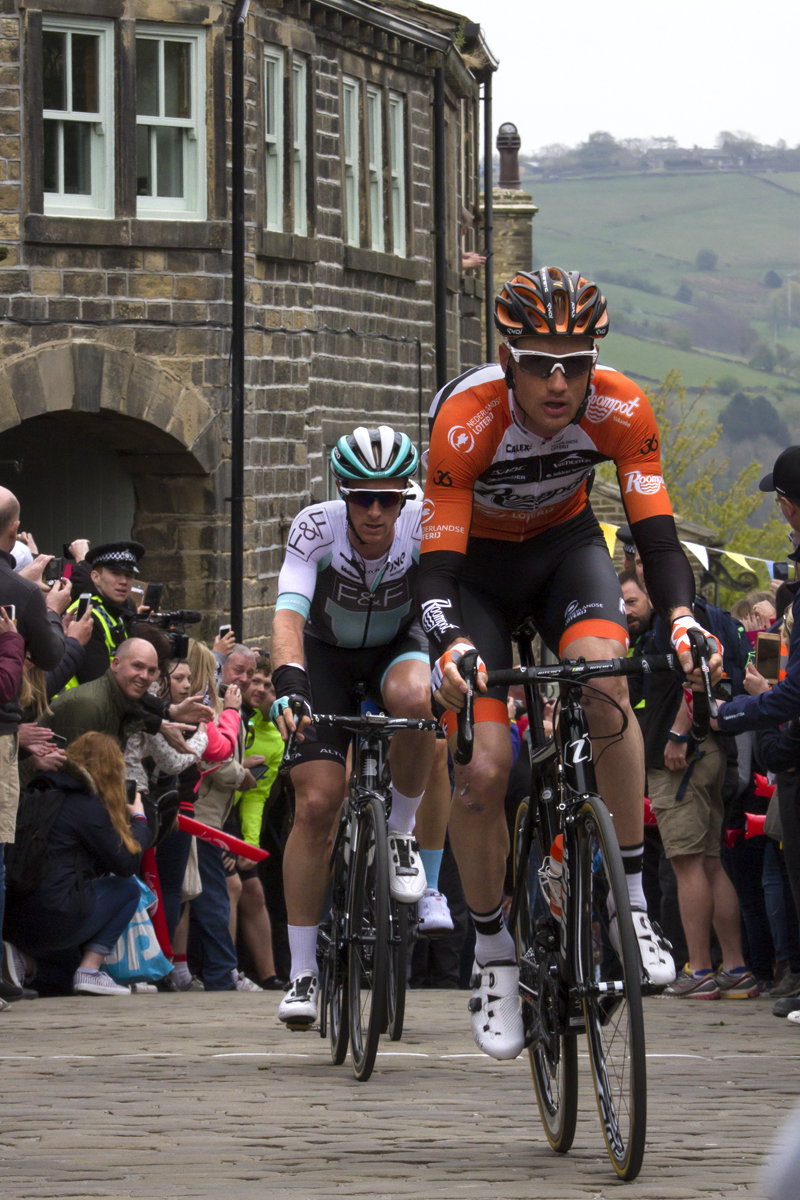 Tour de Yorkshire 2017 - the lead group of riders top the King of the Mountains climb at Haworth