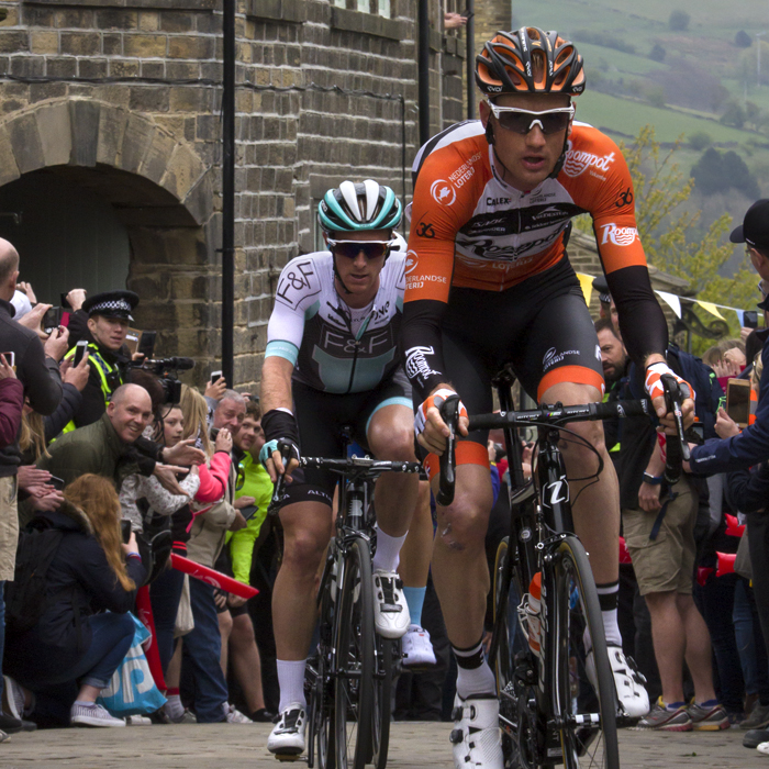 Tour de Yorkshire 2017 - the lead group of riders top the King of the Mountains climb at Haworth