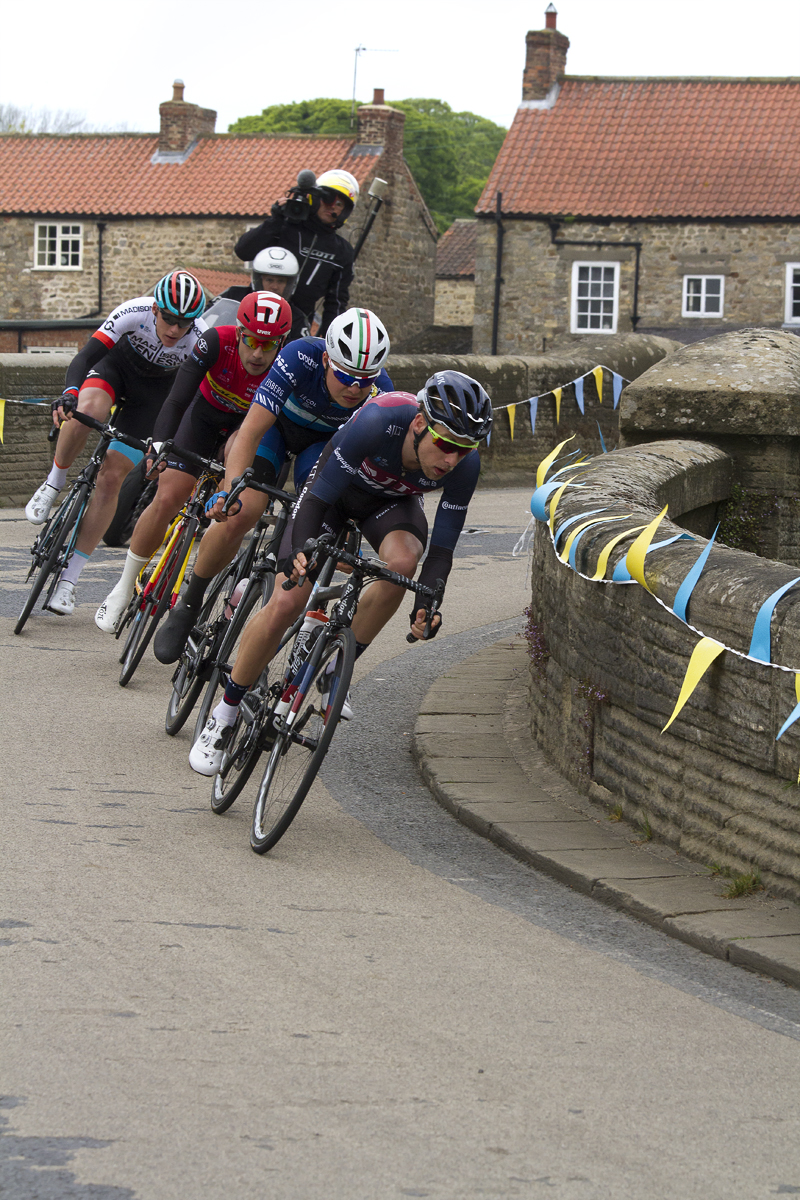 Tour de Yorkshire 2017 - A group of riders cross the bridge at West Tanfield