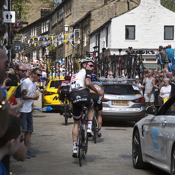 Tour de Yorkshire 2018 - Mike Teunissen looks for his support car as he climbs a packed hill in Haworth