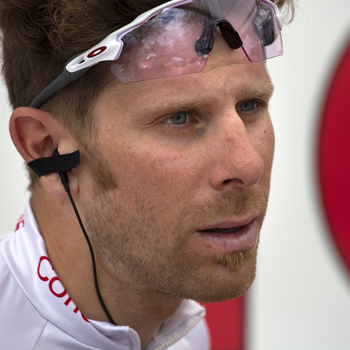 Tour de Yorkshire 2019 - Filippo Fortin with his sunglasses pushed onto his forehead outside the Cofidis bus