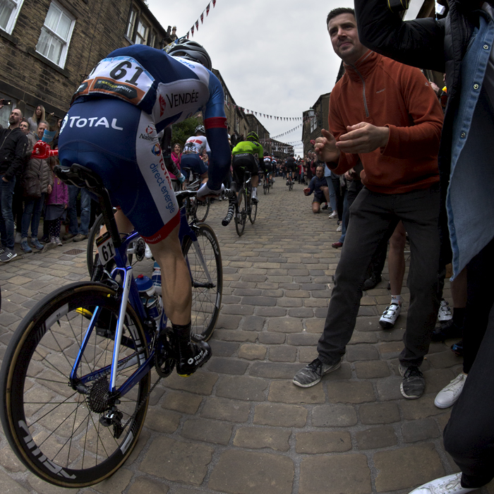 Tour de Yorkshire 2019 - Jonathan Hivert pushes past fans on the cobbled climb in Haworth