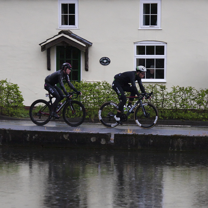 Tour de Yorkshire 2019 - An old lady looks out the window of  White Rose Cottage,  Warter to see the race pass