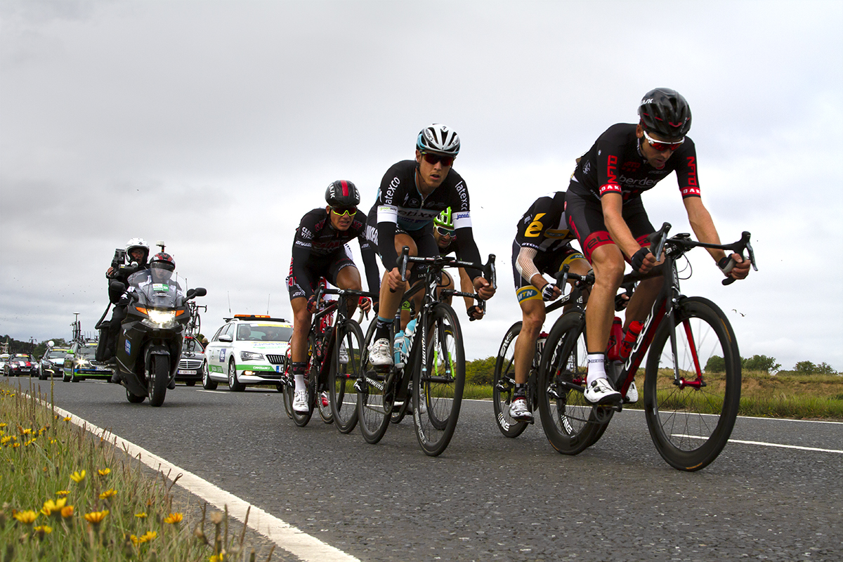 Tour of Britain 2015 - a group of riders race near Warkworth