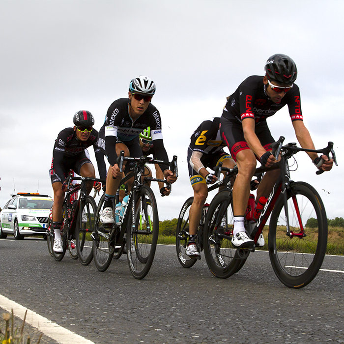 Tour of Britain 2015 - a group of riders race near Warkworth