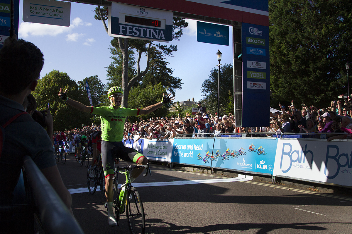 Tour of Britain 2016 - Jack Bauer raises his hands in victory at the end of the stage in Bath