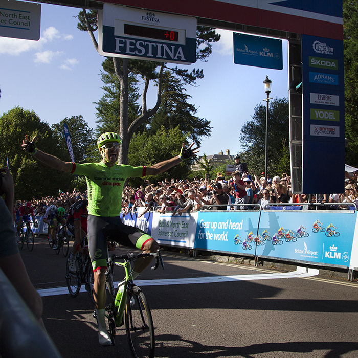 Tour of Britain 2016 - Jack Bauer raises his hands in victory at the end of the stage in Bath