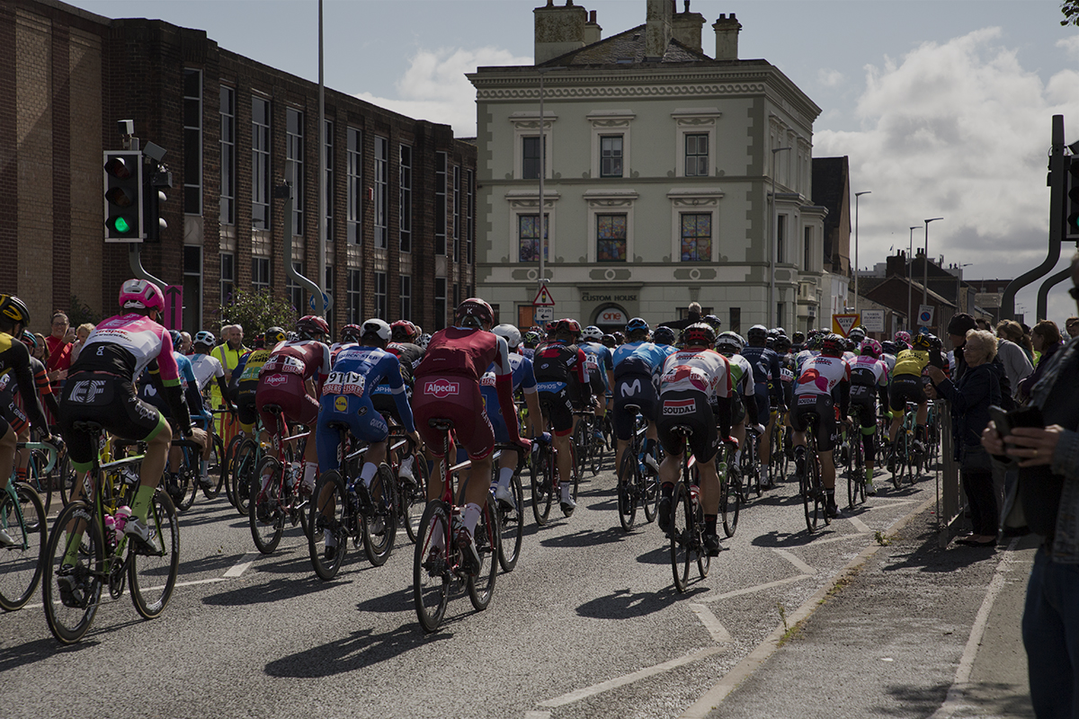 Tour of Britain 2018 - The peloton rolls past fans on its way out of Barrow-in Furness