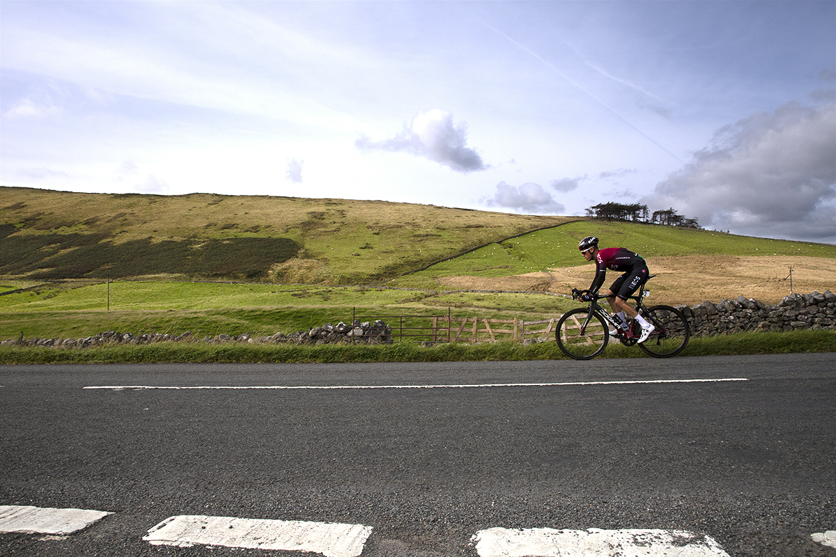 Tour of Britain 2019 - Dylan van Baarle passes by dry stone walls and hilly countryside near Sedburgh