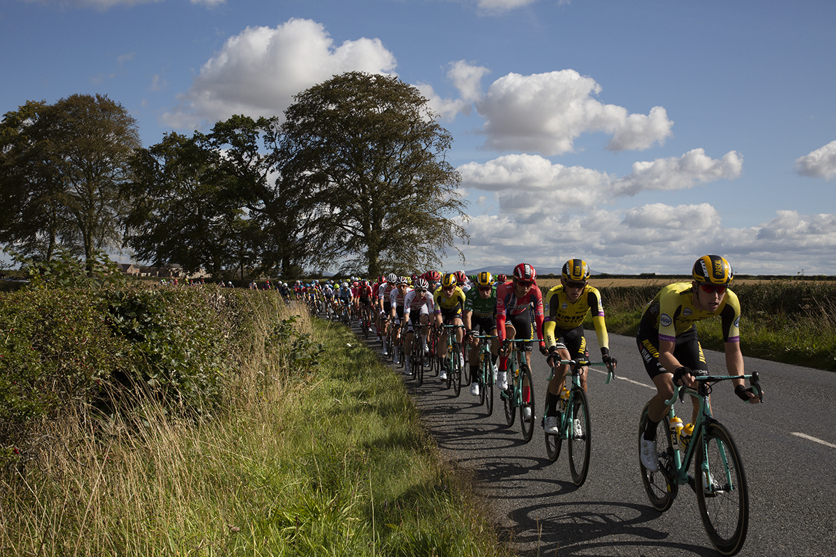 Tour of Britain 2019 - Jumbo Visma lead the peloton through the Scottish countryside on the outskirts of Kelso