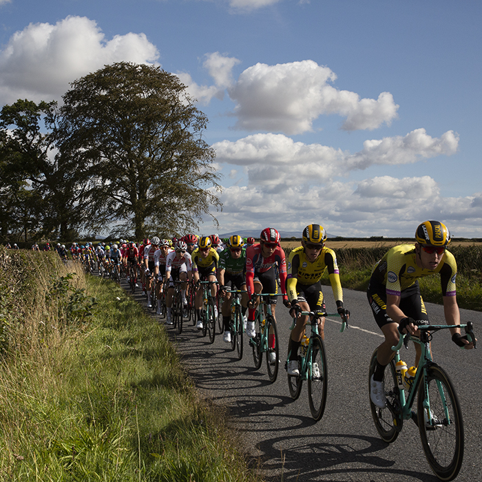 Tour of Britain 2019 - Jumbo Visma lead the peloton through the Scottish countryside on the outskirts of Kelso