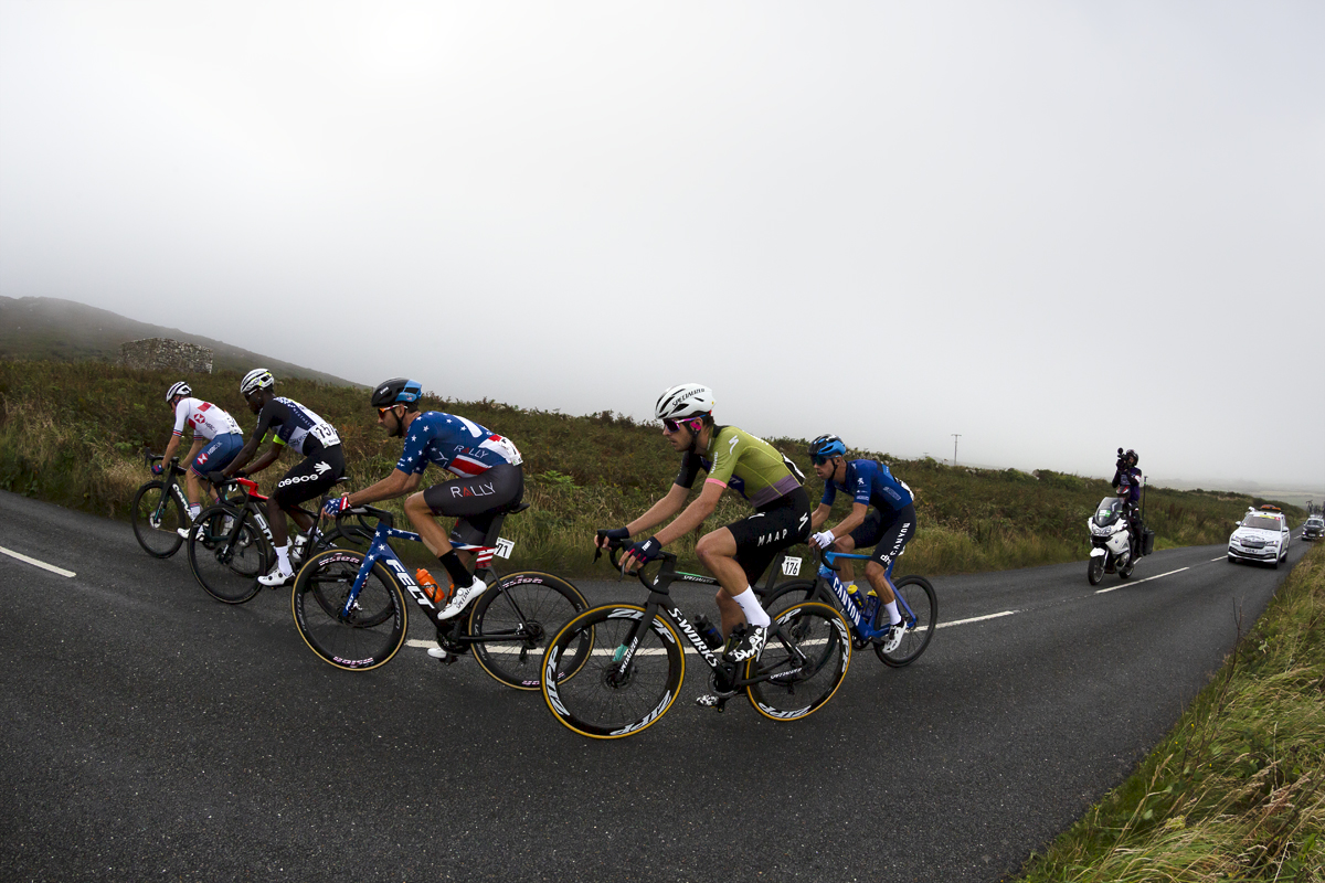 Tour of Britain 2021 - The breakaway pass through moorland with Watch Croft hill in the background