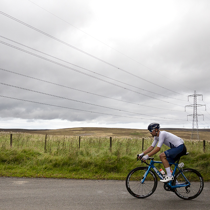 Tour of Britain 2021 - Ross Lamb of SwiftCarbon Pro Cycling passes through the moorland of Crow Moss in the Scottish Borders