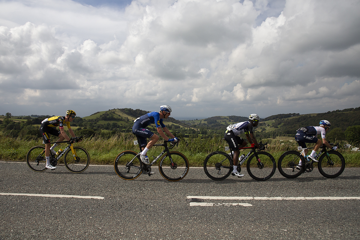 Tour of Britain 2021 - Riders pass through the Peak District with Blaze Hill in the background