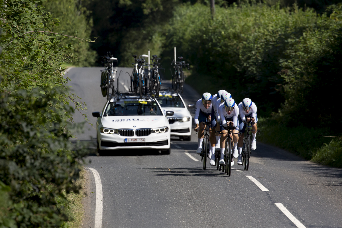 Tour of Britain 2021 - Team Time Trial - Israel Start-Up Nation are followed by their support vehicles through the roads of Carmarthernshire