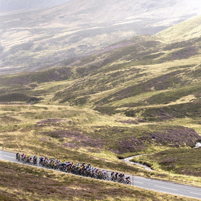 Tour of Britain 2022 - The peloton makes its way up Cairnwell Pass