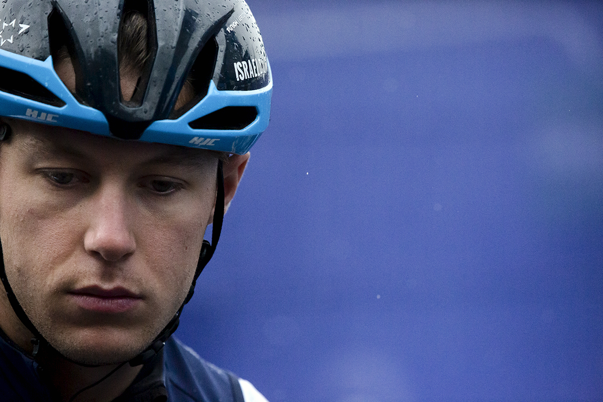 Tour of Britain 2022 - Corbin Strong of Israel - Premier Tech waits for the race to start as the rain falls