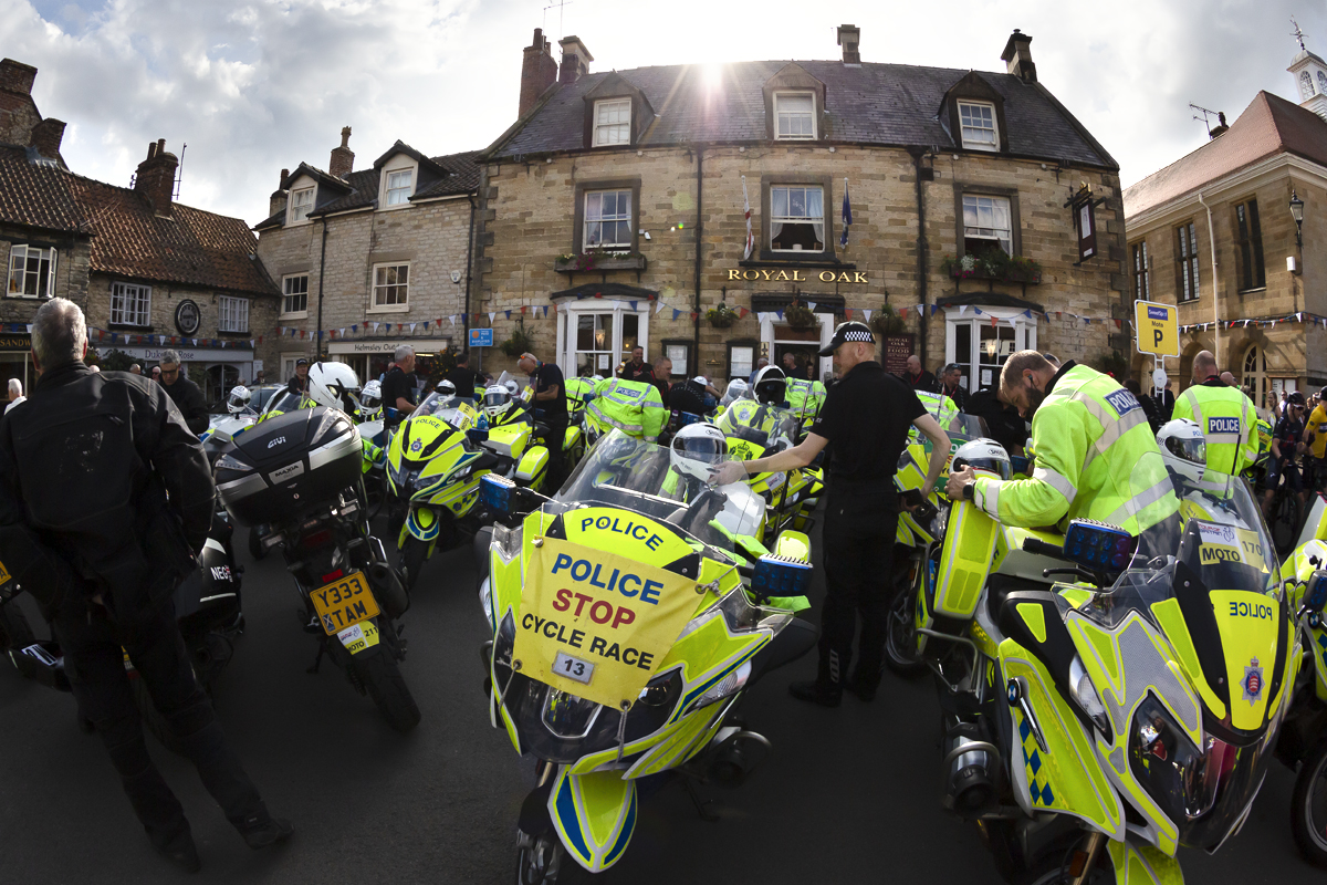 Tour of Britain 2022 - Police convoy bikes outside the Royal Oak Helmsley