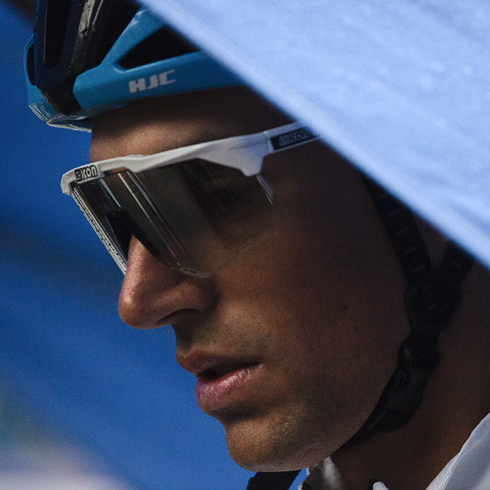 Tour of Britain 2022 - Reto Hollenstein of Israel - Premier Tech shelters under a blue gazebo before signing on at the Tour of Britain in Aberdeen