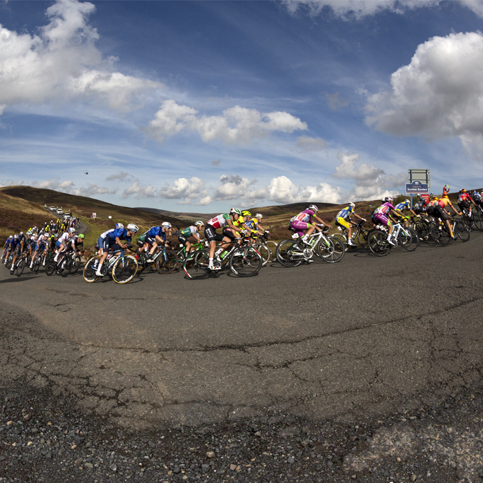 Tour of Britain 2022 - The peloton take on a switchback before tackling the climb of Mainslaughter Law