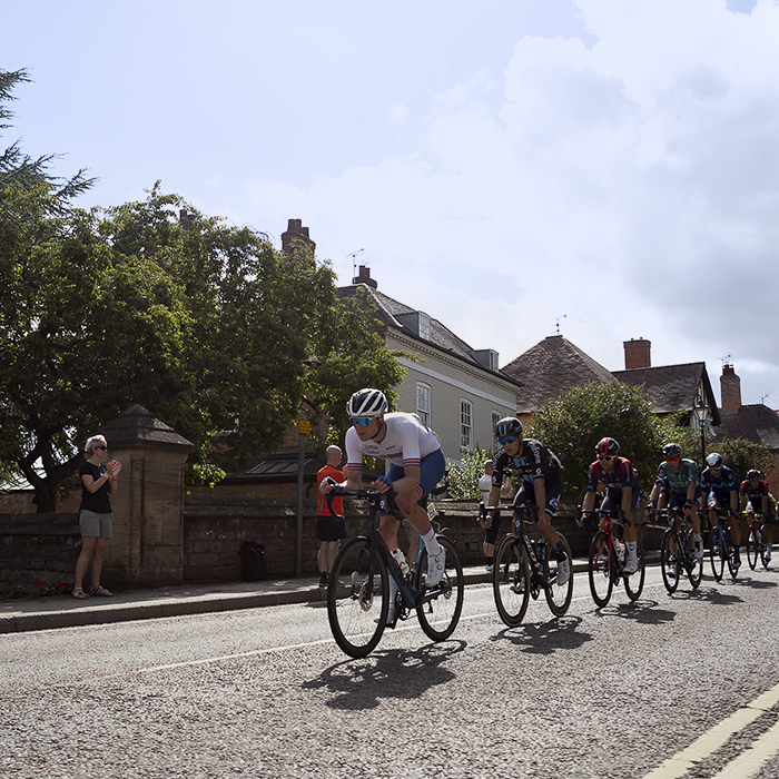 Tour of Britain 2022 - The Peloton makes its way down Westgate in Southwell