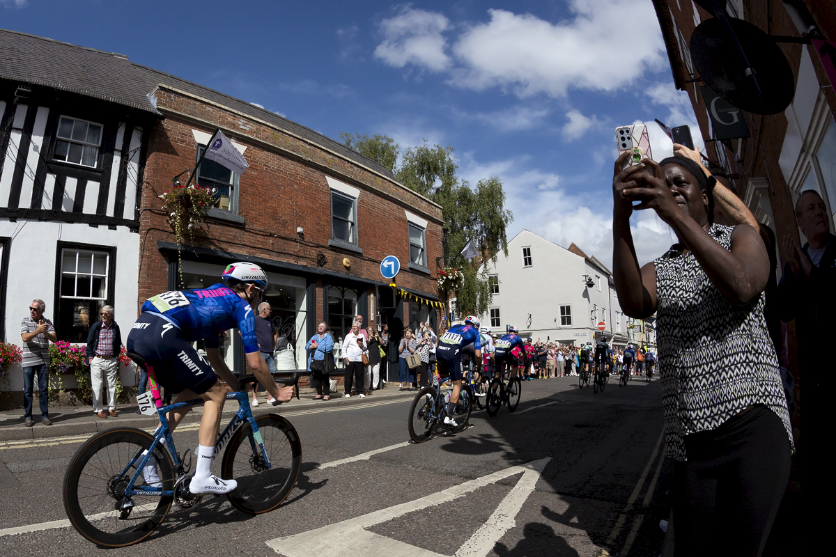 Tour of Britain 2022 - Riders from Trinity Racing pass down King Street in Southwell as fans line the roadside