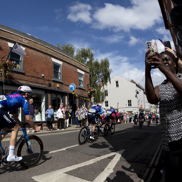 Tour of Britain 2022 - Riders from Trinity Racing pass down King Street in Southwell as fans line the roadside