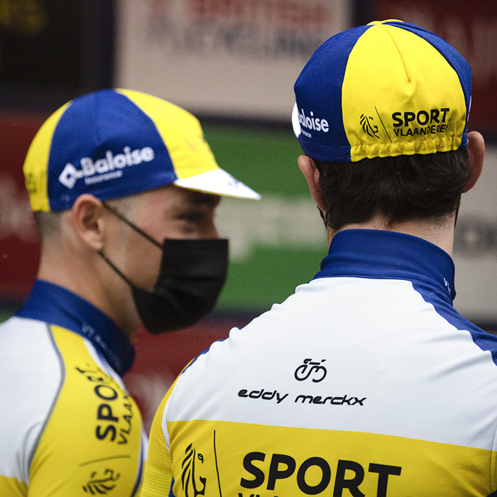 Tour of Britain 2022 - Two members of Sport Vlaanderen - Baloise wear masks in front of the podium