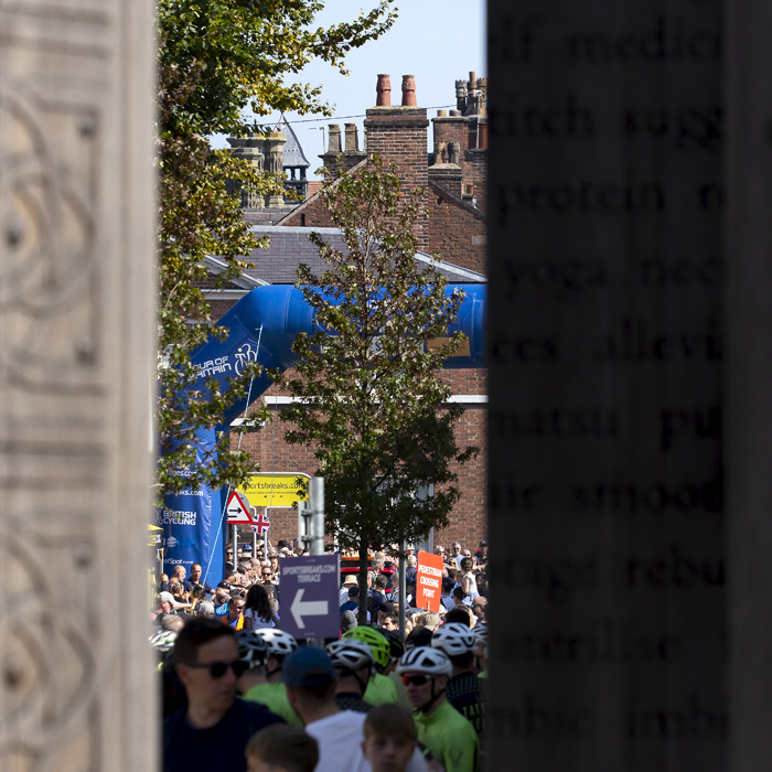 Tour of Britain 2023 - The race start line can be seen through the carved wooden pillars of Altrincham Market