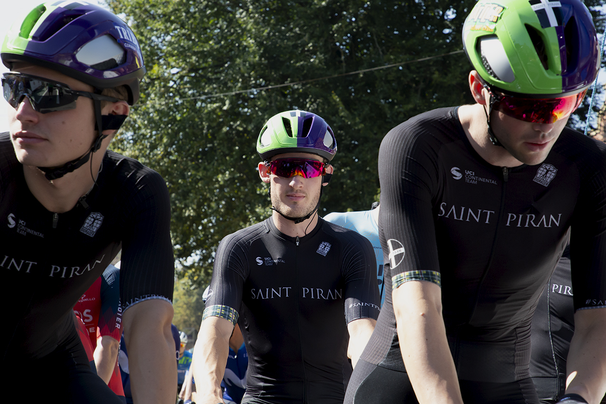 Tour of Britain 2023 - Harry Birchill of Saint Piran is framed by two of his team mates on the start line