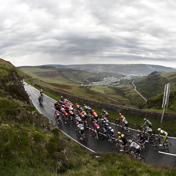 Tour of Britain 2023 - Riders on Bwlch Mountain with a view of the valley below