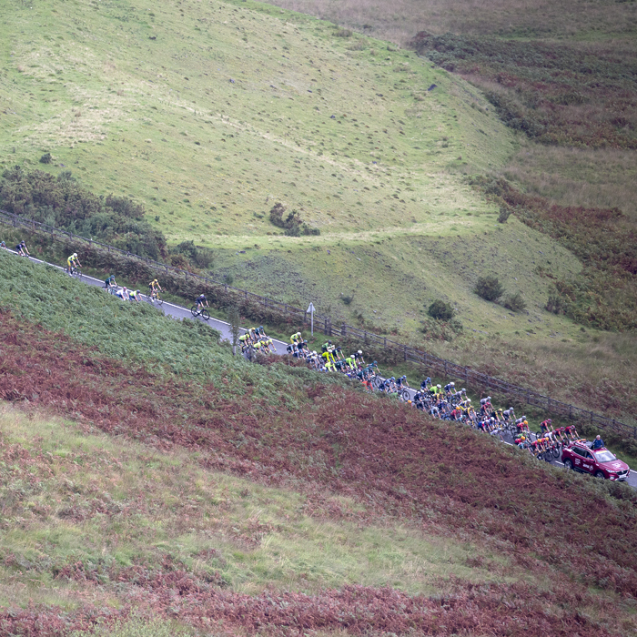 Tour of Britain 2023 - Riders seen from above with moorland in the foreground