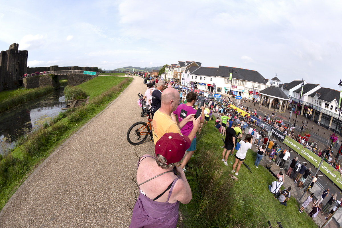 Tour of Britain 2023 - Spectators line the banks round the castle to gain a vantage point for the race