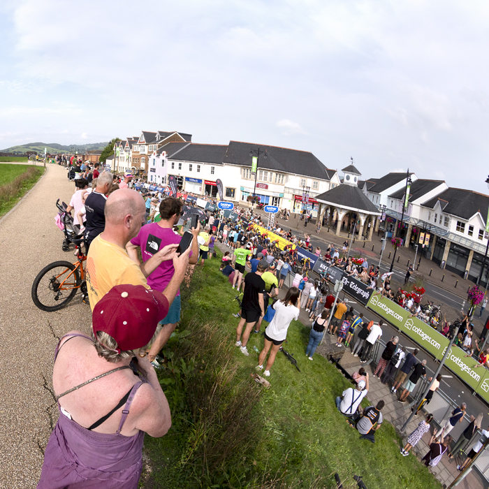 Tour of Britain 2023 - Spectators line the banks round the castle to gain a vantage point for the race