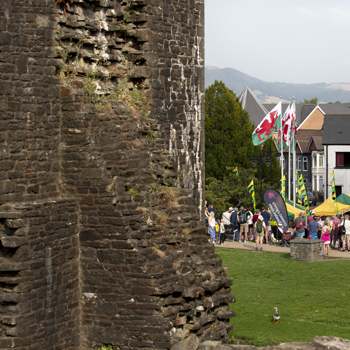 Tour of Britain 2023 - Caerphilly Castle is seen in the foreground as spectators wait for the race to arrive