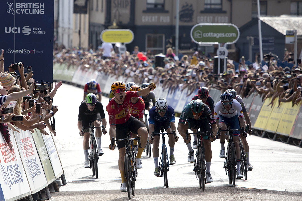 Tour of Britain 2023 - Rasmus Tiller of Uno-X Pro Cycling Team punches the air in victory as he takes the stage win