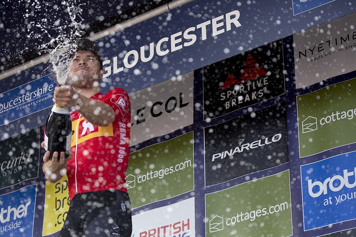 Tour of Britain 2023 - Rasmus Tiller of Uno-X Pro Cycling Team sprays champagne on the podium