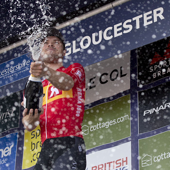 Tour of Britain 2023 - Rasmus Tiller of Uno-X Pro Cycling Team sprays champagne on the podium