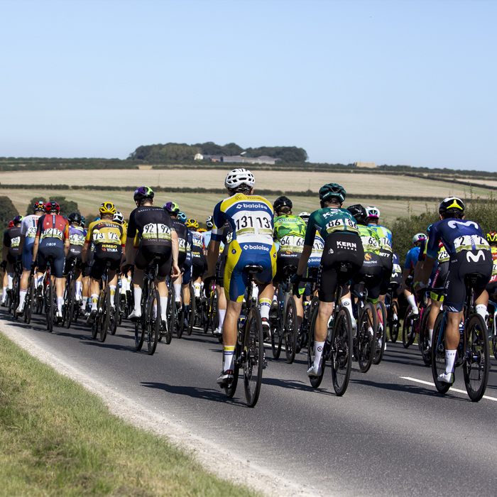 Tour of Britain 2023 - Rear view of the peloton passing through the Yorkshire Wolds