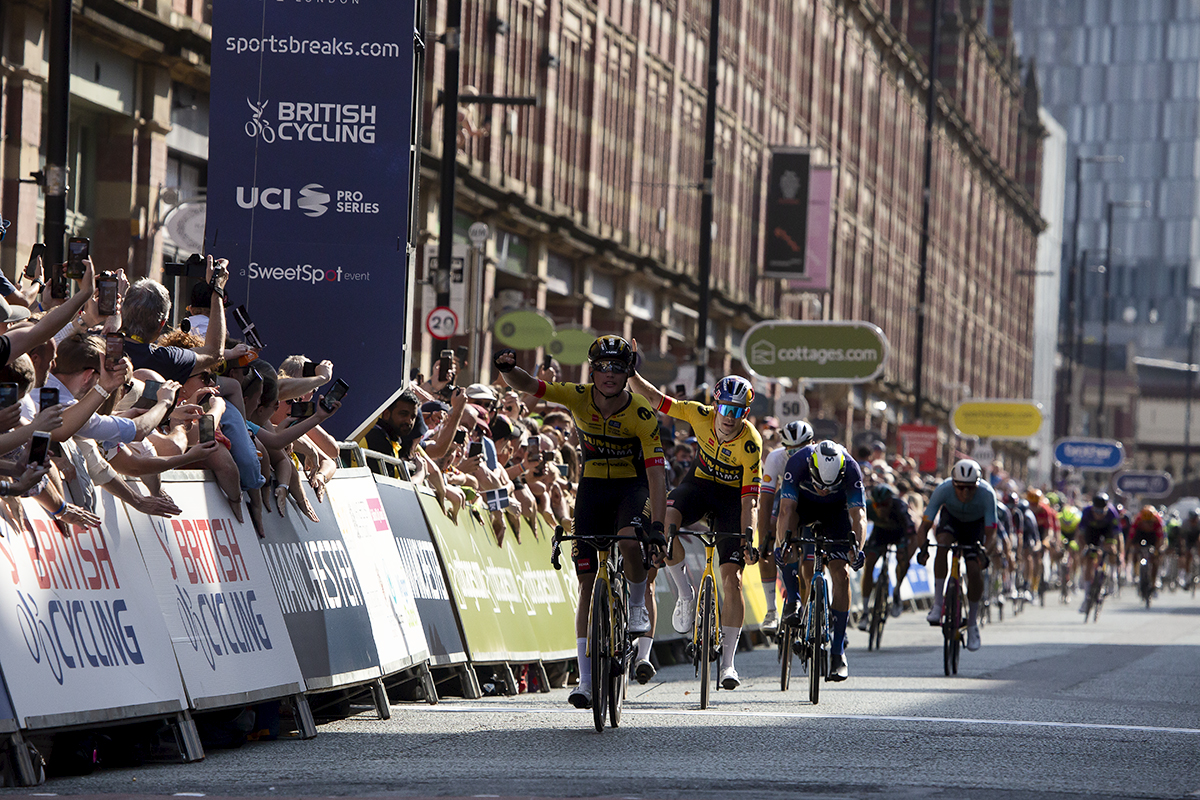 Tour of Britain 2023 - Olav Kooij of and Wout van Aert of Jumbo-Visma raise their hands in celebration as Kooij crosses the finish line in first place