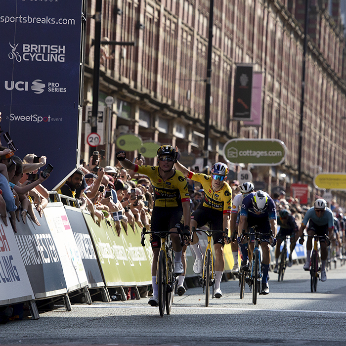 Tour of Britain 2023 - Olav Kooij of and Wout van Aert of Jumbo-Visma raise their hands in celebration as Kooij crosses the finish line in first place