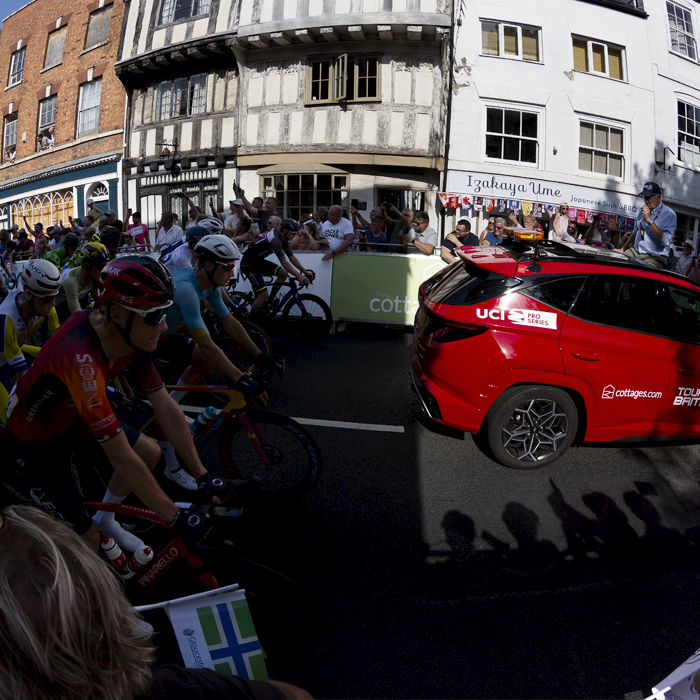 Tour of Britain 2023 - The race follows the race car out of the shadows and through the streets of Tewkesbury