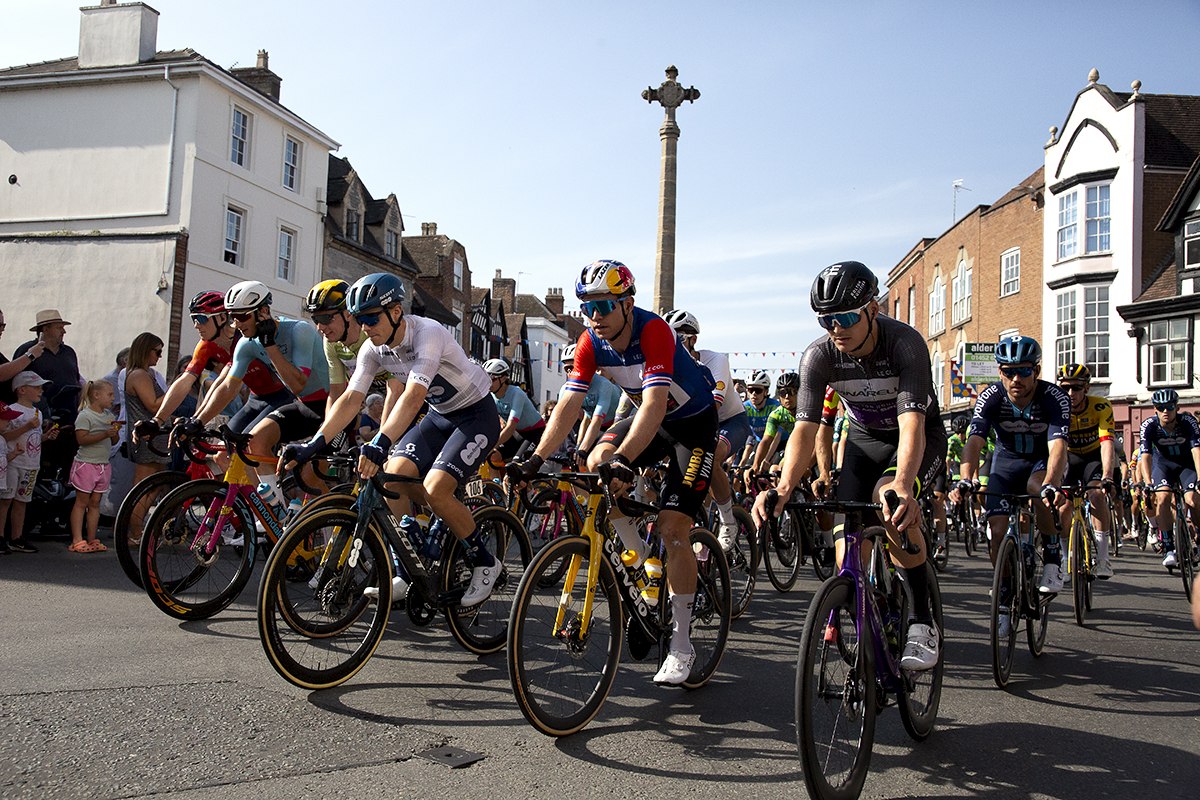 Tour of Britain 2023 - Riders pass the market cross in Tewkesbury