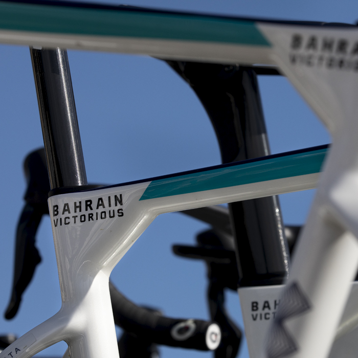 Tour of Britain 2024 - Detail of Bahrain Victorious bikes against the bright blue sky